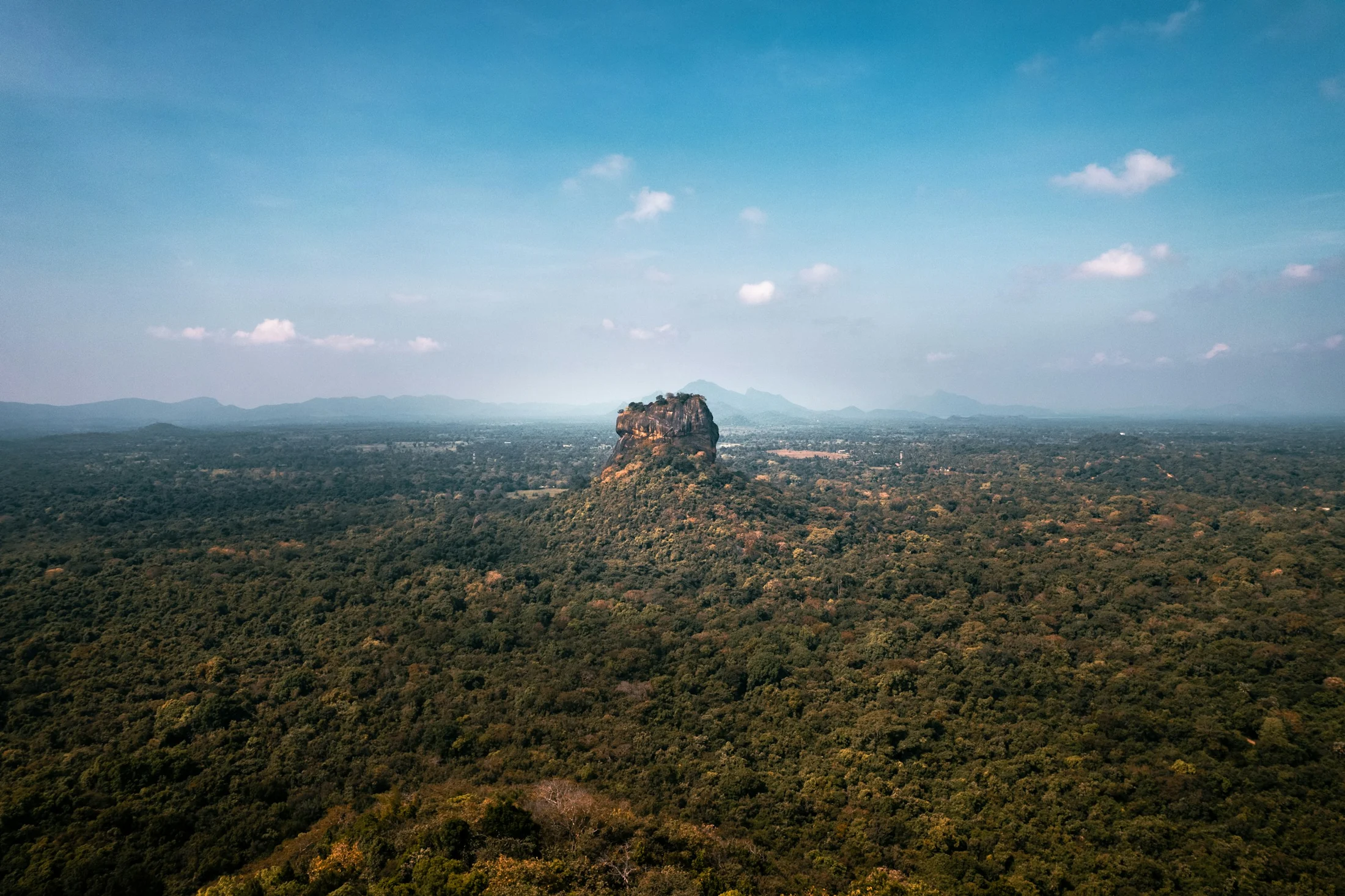 Sigiriya rock rising above the lush Sri Lankan jungle